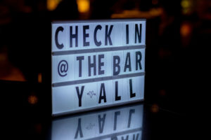 check in @ the bar y'all sign on bartop