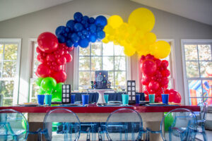superhero birthday party for boys, balloon installation, blue ghost chairs